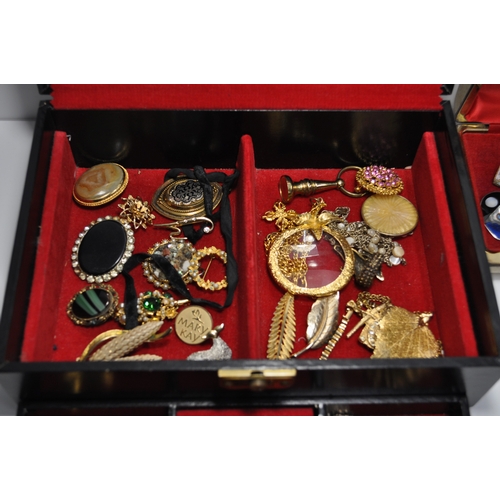 12 - A quantity of costume jewellery to include rings, necklaces, brooches, bracelets, etc. to include so... 