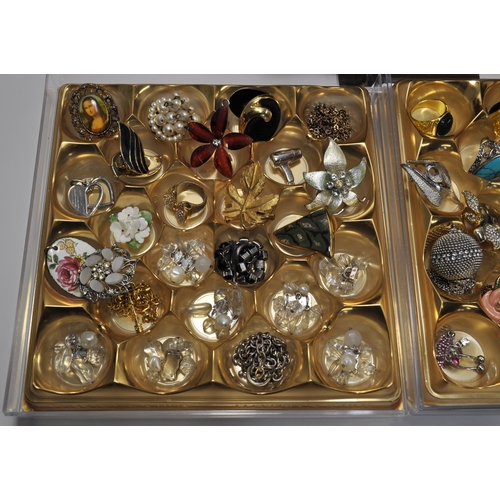 16 - A large quantity of costume jewellery to include brooches, pendants, rings, colourful bangle/bracele... 