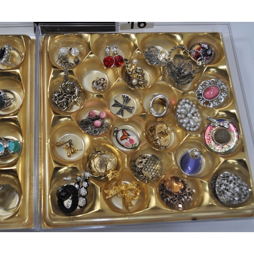 16 - A large quantity of costume jewellery to include brooches, pendants, rings, colourful bangle/bracele... 