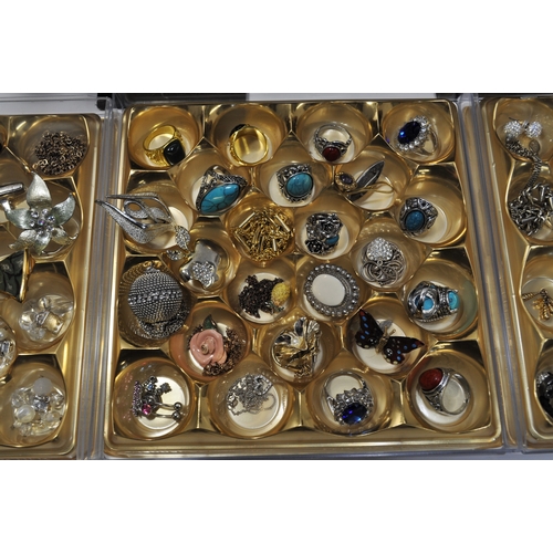 16 - A large quantity of costume jewellery to include brooches, pendants, rings, colourful bangle/bracele... 