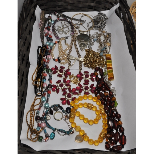 20 - A quantity of costume jewellery items consisting buckles, necklaces, pendants, brooches etc.