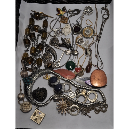 20 - A quantity of costume jewellery items consisting buckles, necklaces, pendants, brooches etc.