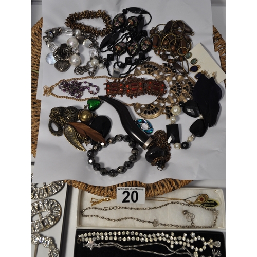 20 - A quantity of costume jewellery items consisting buckles, necklaces, pendants, brooches etc.