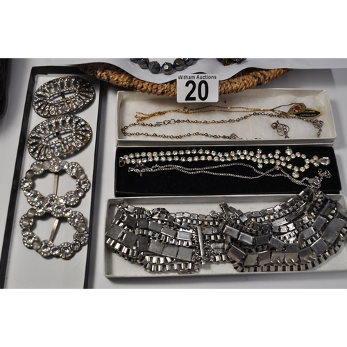 20 - A quantity of costume jewellery items consisting buckles, necklaces, pendants, brooches etc.