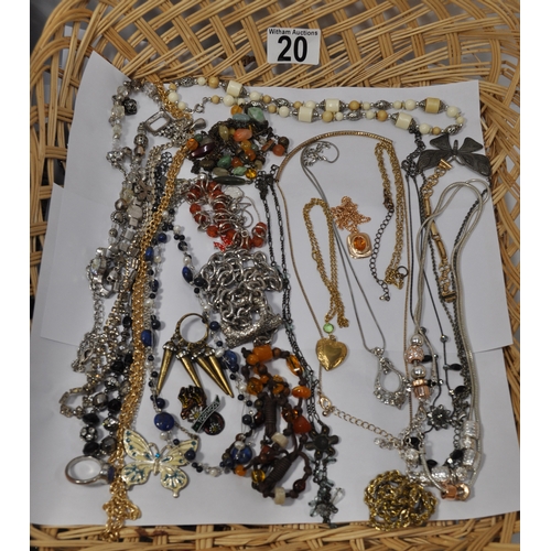 20 - A quantity of costume jewellery items consisting buckles, necklaces, pendants, brooches etc.