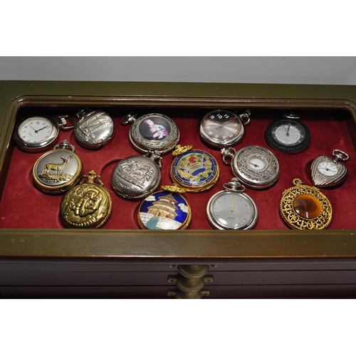 105 - A large quantity of novelty pocket watches (x34) presented in a three drawer display unit measuring ... 