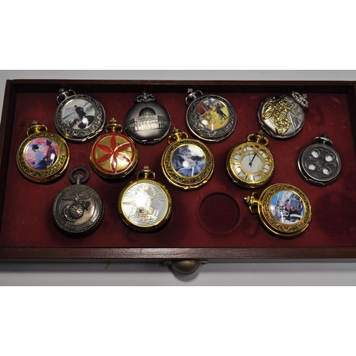 105 - A large quantity of novelty pocket watches (x34) presented in a three drawer display unit measuring ... 