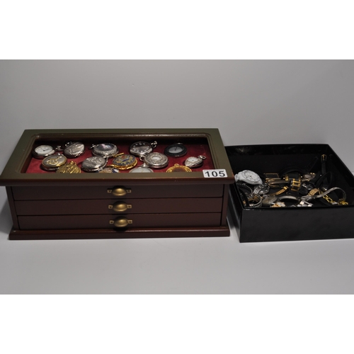 105 - A large quantity of novelty pocket watches (x34) presented in a three drawer display unit measuring ... 