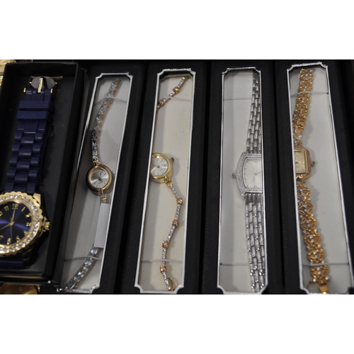 108 - A large quantity of ladies wristwatches, in a variety of colours and designs.