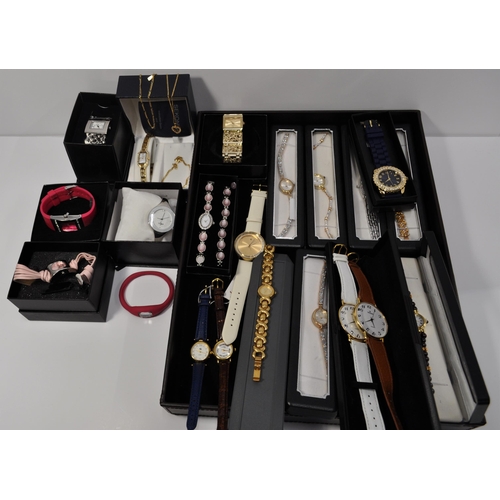 108 - A large quantity of ladies wristwatches, in a variety of colours and designs.