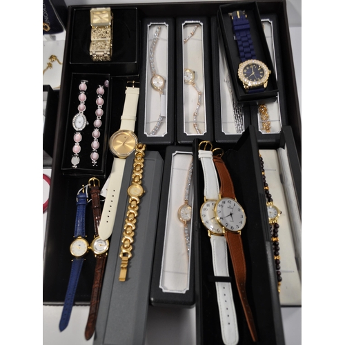 108 - A large quantity of ladies wristwatches, in a variety of colours and designs.