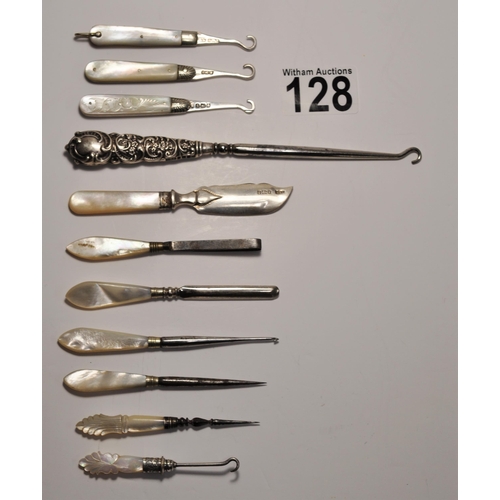 128 - A collection of silver, white metal and mother of pearl  button hooks/crochet/butter spreader, some ... 