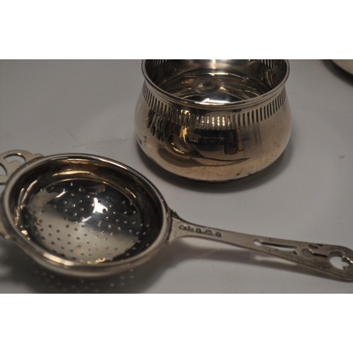 130 - Vintage and antique silver items matching sugar and cream jug, napkin rings, tea strainer, traveling... 