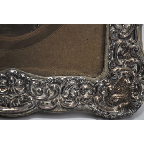 133 - Antique photo frame of repousse design, hallmarked Chester 1906, with portraiture of serviceman, app... 