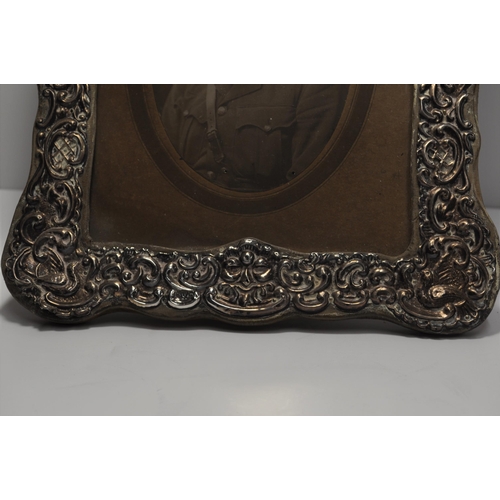 133 - Antique photo frame of repousse design, hallmarked Chester 1906, with portraiture of serviceman, app... 