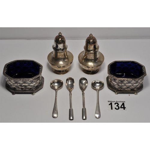 134 - A Pair of silver pepperettes, hallmarked London 1917, makers stamp AC poss. Alfred Clark together wi... 