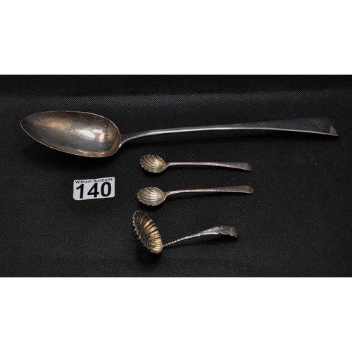 140 - A Georgian basting spoon by Alexander Hewat together with a  pair of silver shell design spoons plus... 