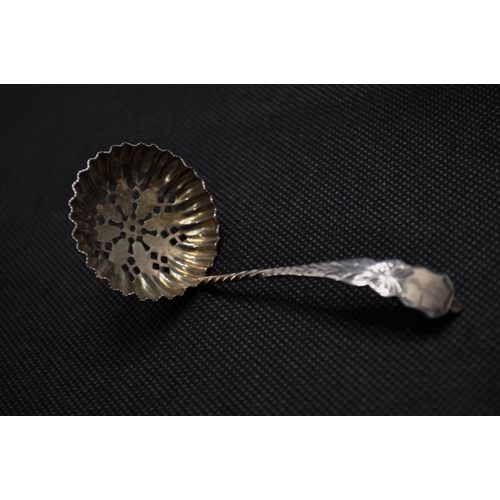 140 - A Georgian basting spoon by Alexander Hewat together with a  pair of silver shell design spoons plus... 