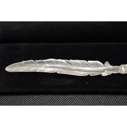 146 - A Dutch silver letter opener in the style of a feather hallmarked Gouda c.1999 together with glass i... 