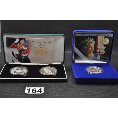 164 - Her Majesty the Queen 2002 Jubilee Silver Crown boxed Set, with literature together with Golden jubi... 