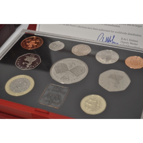 167 - x3 Royal Mint boxed sets; a 1997 UK proof coin collection with certificate which includes a £5 coin ... 