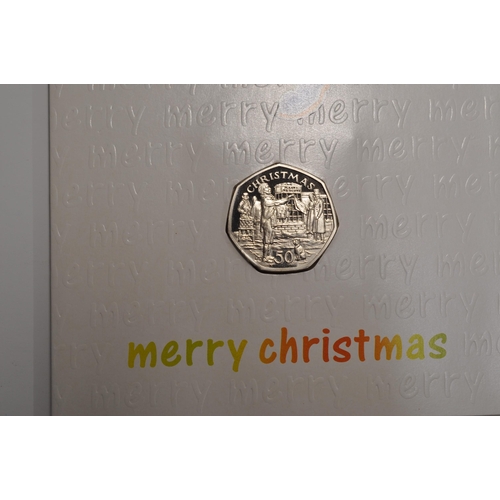 182 - Pobjoy Mint Isle of Man Christmas 50 pence coin inset into original Pobjoy Christmas Card with Pobjo... 