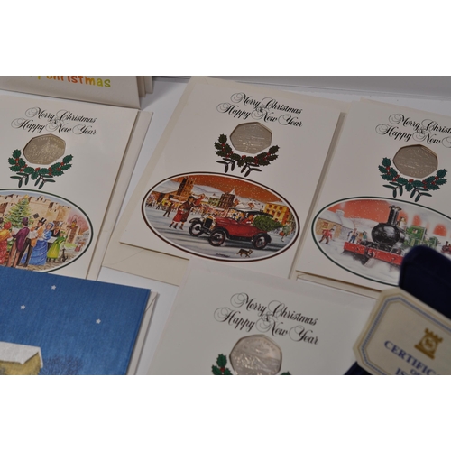 182 - Pobjoy Mint Isle of Man Christmas 50 pence coin inset into original Pobjoy Christmas Card with Pobjo... 