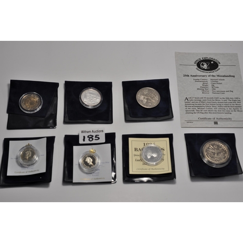 185 - A group of mixed commemorative coins and stamps to include, first day covers, Guernsey silver proof ... 