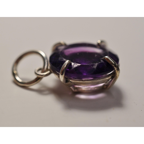 39 - Substantial 9.85ct amethyst brilliant cut round stone pendant, stone measuring approx. 16mm x 16mm, ... 