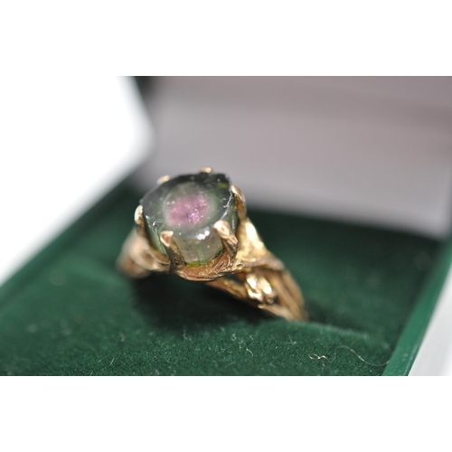 49 - Two 9ct yellow gold rings, one of which holds a watermelon tourmaline? in raised decorative mount A/... 