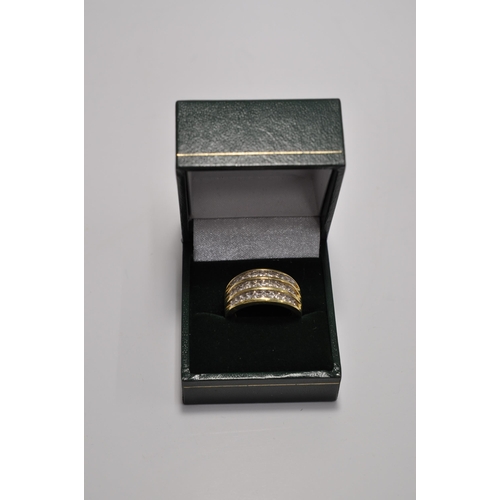 50 - A 18ct yellow gold ring with three rows of graduating diamonds hallmarked London 750, approx. gross ... 