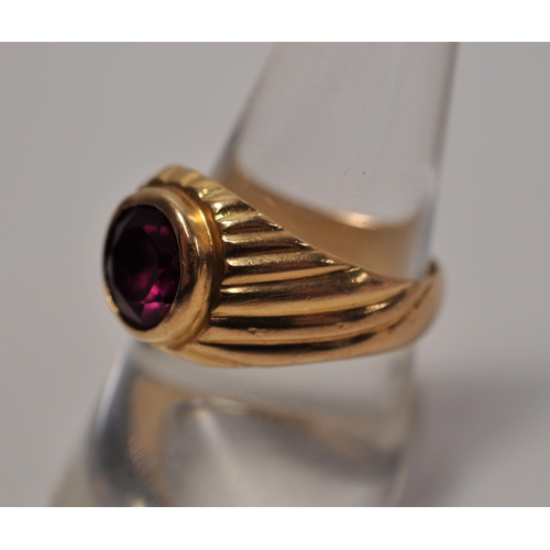 55 - Yellow gold ring with red stone, tested as 18ct approx. gross weight 6.6g size N1/2, together with a... 