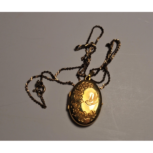 83 - A 9ct yellow gold locket with bird and fauna design to front, chain length approx. 18