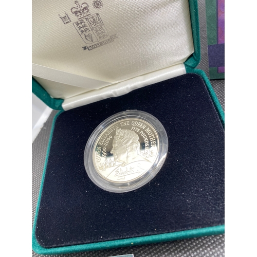 35 - Royal Mint The Queen Mother silver centenary coin in box with certificate together with Royal Mint Q... 