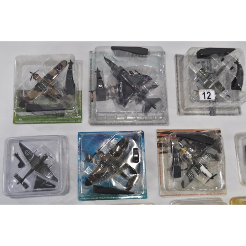 12 - Group of 1:10 and 1:72 scale diecast model aircraft (in unopened plastic sleeves) to include Spitfir... 