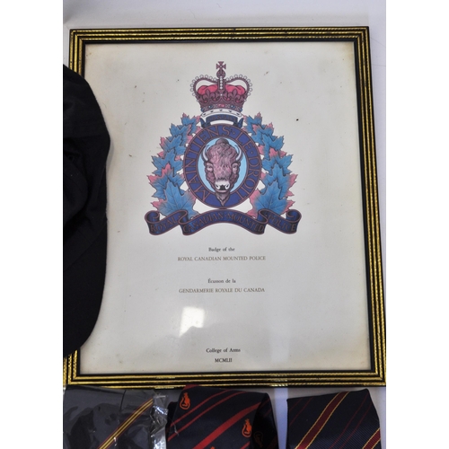 127 - Framed Royal Canadian Mounted Police College of Arms together with various RMP and other Military Ca... 