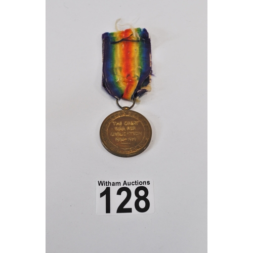 128 - A pair of WWI medals attributed to 198019 GNR.C.BROWN. R.A. together with x2 military cloth badges a... 