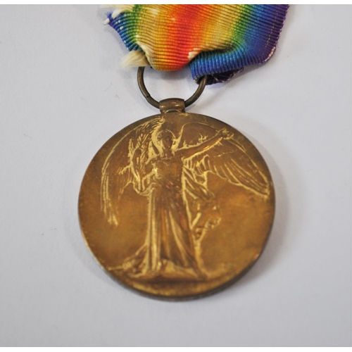 128 - A pair of WWI medals attributed to 198019 GNR.C.BROWN. R.A. together with x2 military cloth badges a... 