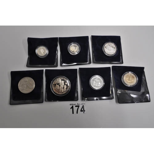 174 - A group of mixed commemorative coins and stamps to include, first day covers, Guernsey silver proof ... 