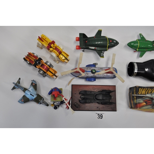 39 - A collection of different aircraft models and action figures to include Spiderman, Thunderbirds, Roc... 