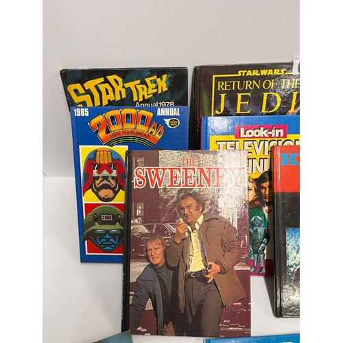 69 - A collection of different annuals from years starting from 1976 to include Star Trek, Star Wars, 200... 