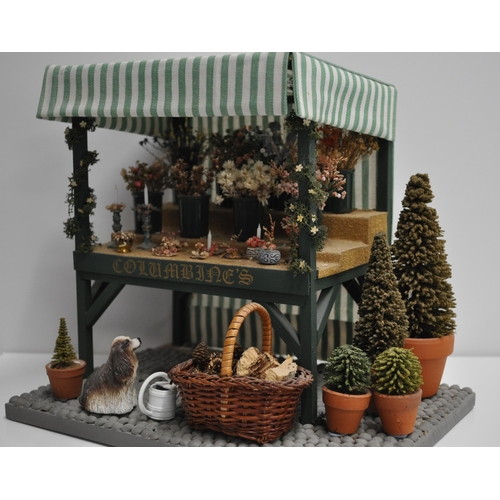 92 - Diorama scene of a flower stand with various items displayed and barn shed scene with various items ... 