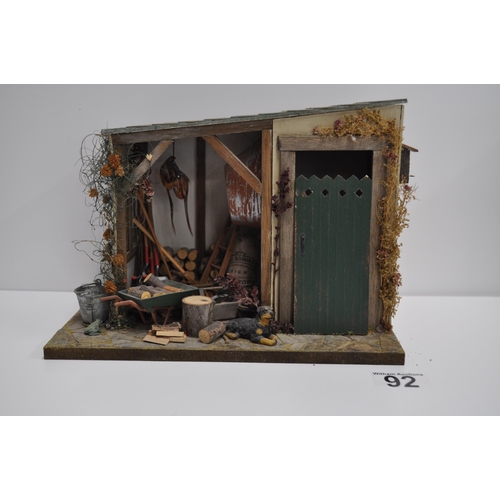 92 - Diorama scene of a flower stand with various items displayed and barn shed scene with various items ... 