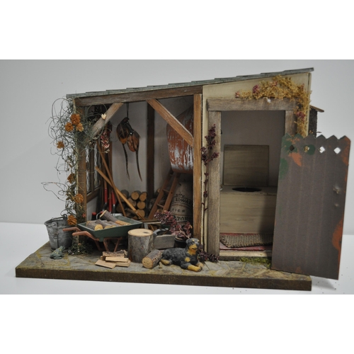 92 - Diorama scene of a flower stand with various items displayed and barn shed scene with various items ... 