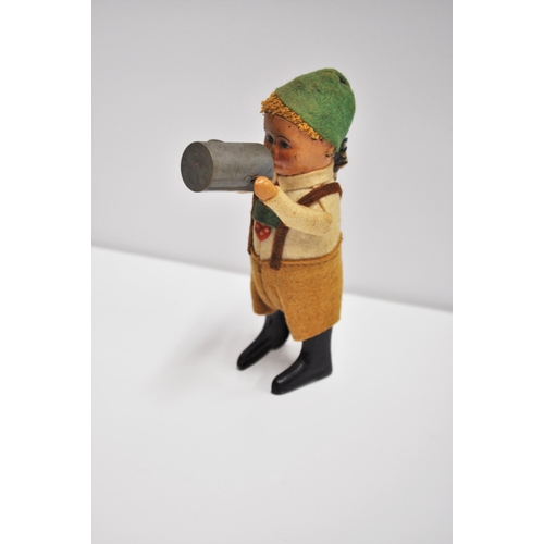 96 - 1930's Schuco early issue tinplate Bavarian child with jug,  mechanical toy with key, working condit... 