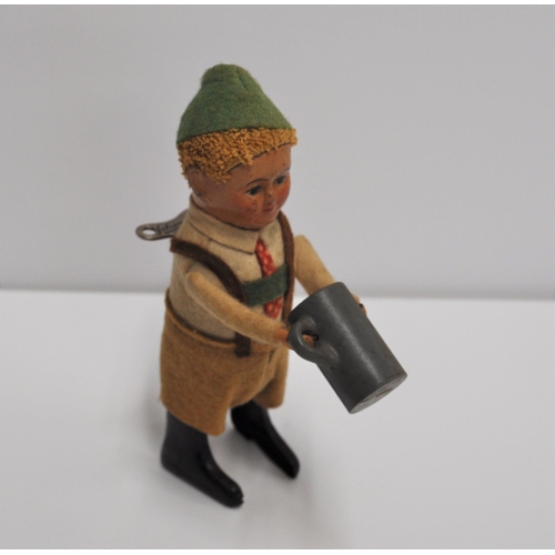 96 - 1930's Schuco early issue tinplate Bavarian child with jug,  mechanical toy with key, working condit... 