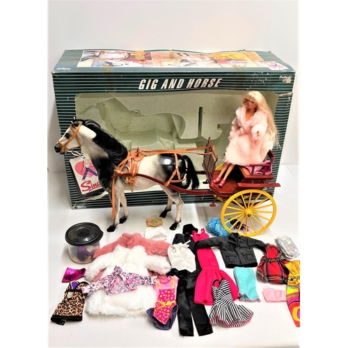 99 - A Sindy Gig and Horse with box together with a blonde Simba Steffi Love doll, misc. clothes and acce... 