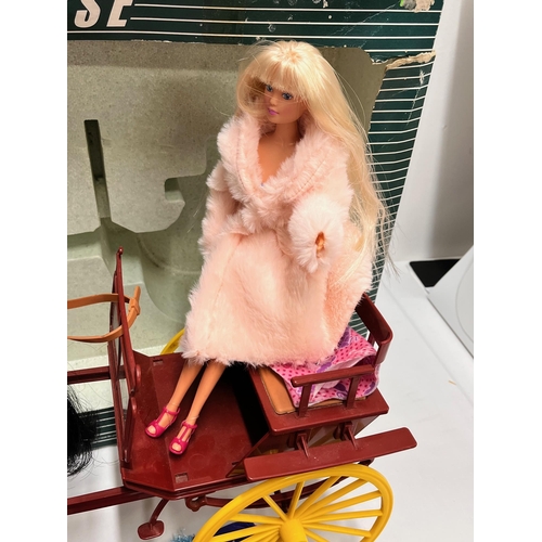 99 - A Sindy Gig and Horse with box together with a blonde Simba Steffi Love doll, misc. clothes and acce... 