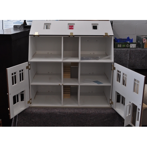 24 - 1/12th scale two storey  doll's house with double fronted bay,  with installed ring main for electri... 