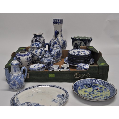 28 - A quantity of blue and white china items of oriental design to include teapots, egg cups, vases, pla... 